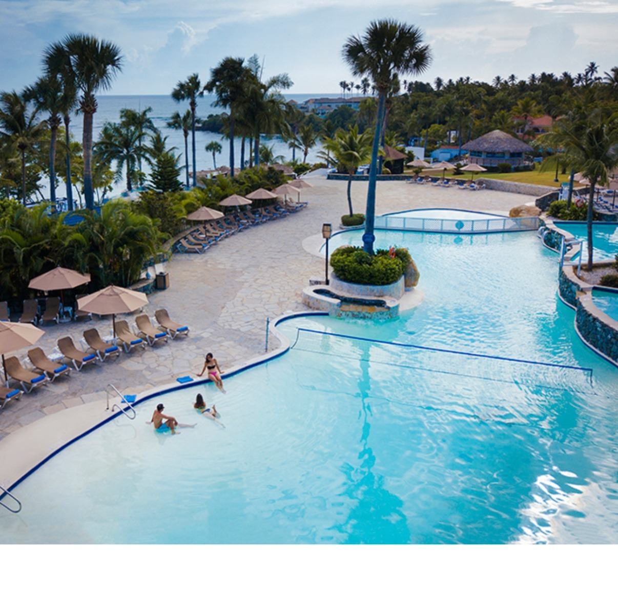 Aerial view of the pool and Caribbean waterfront at The Tropical