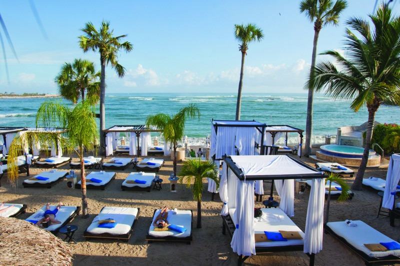 VIP beach cabanas beside the Caribbean Sea at The Tropical