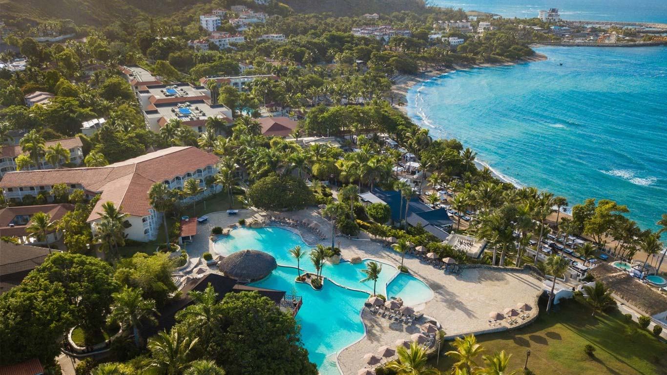 Aerial panorama of the resort grounds and beach at The Tropical