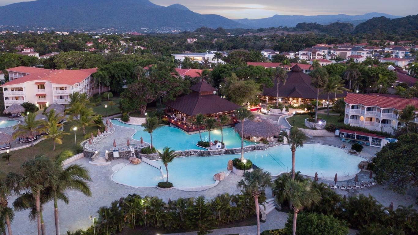 Swimming pool glowing at dusk at The Tropical