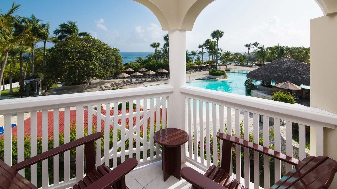 Elevated view across the pool to the beach at The Tropical